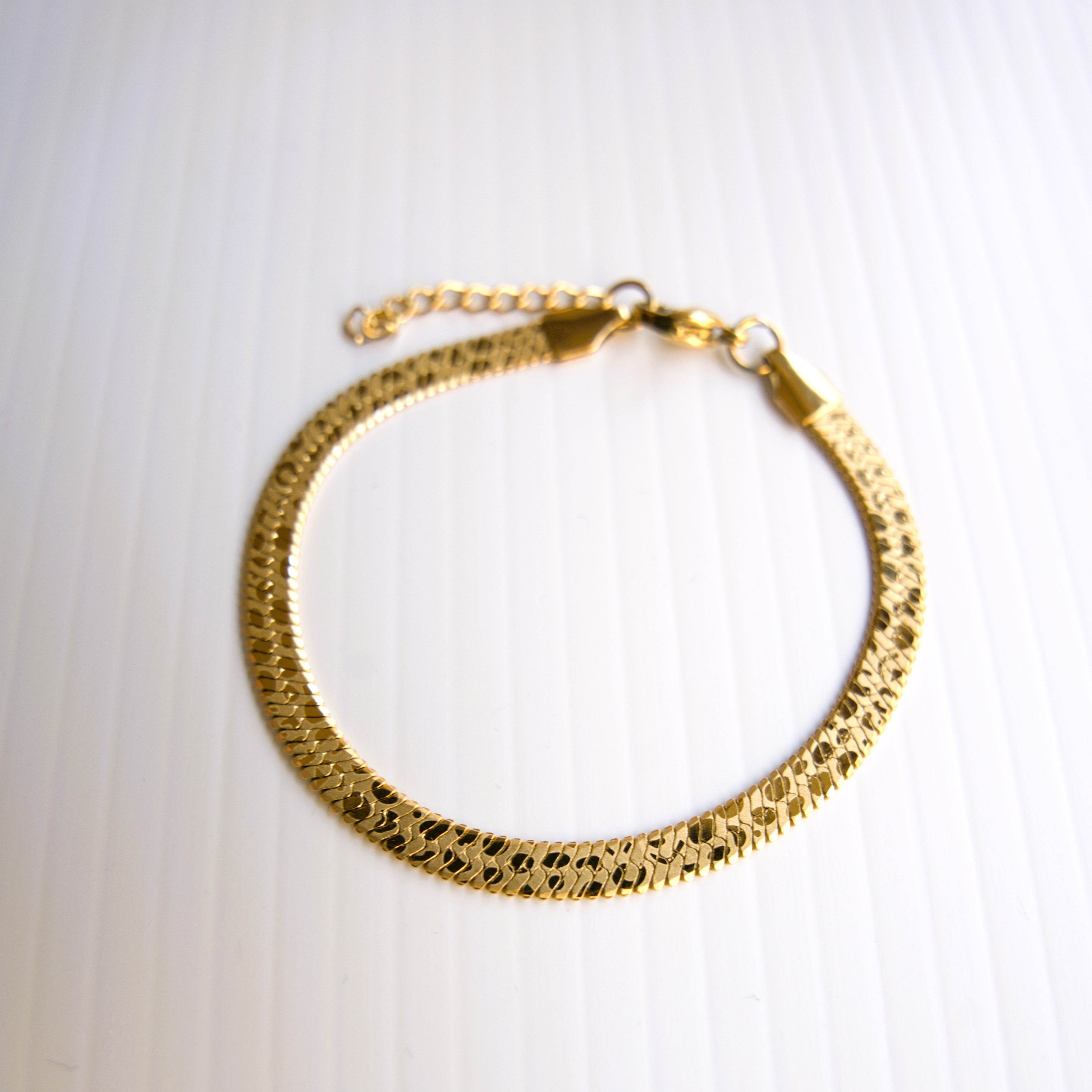 Golden Herringbone Elegance Bracelet